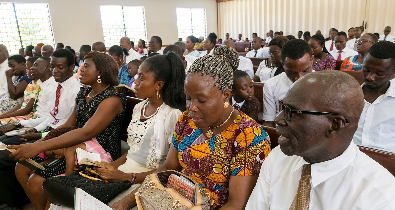 Members singing in a sacrament meeting in a Church meetinghouse