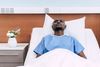 Man sick in bed