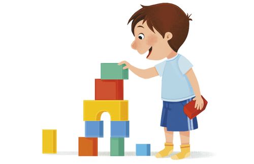 boy stacking blocks