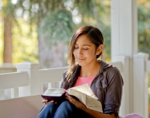 young woman reading scriptures