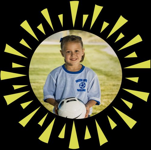 girl holding soccer ball