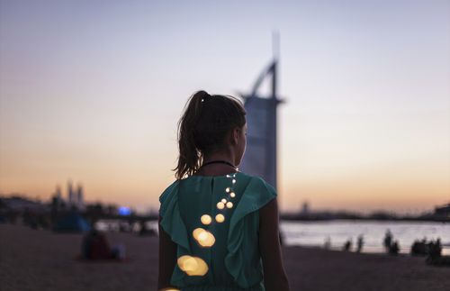 Woman with string of lights in Dubai