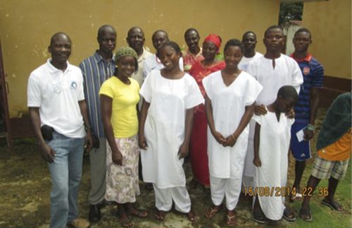 people gathered at baptismal service