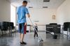 father and boy cleaning a floor