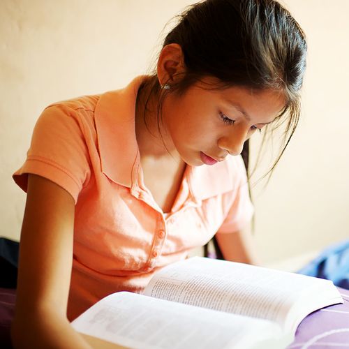 young woman reading the scriptures