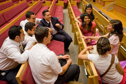 young single adults gathered at chapel in Spain