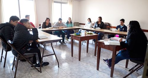 Mendoza, Argentina. A group of young men and young women attend an early morning seminary class.