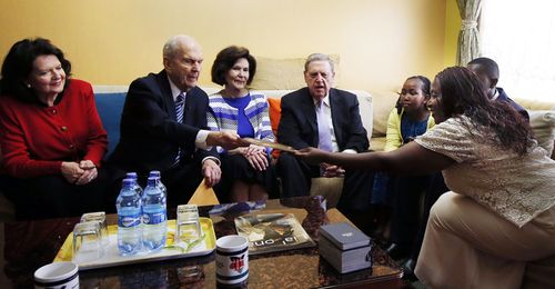 Sister Nelson, President Nelson, Sister Holland, and Elder Holland with family in Kenya