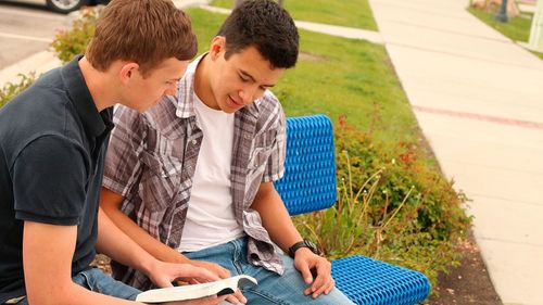 friends reading the scriptures