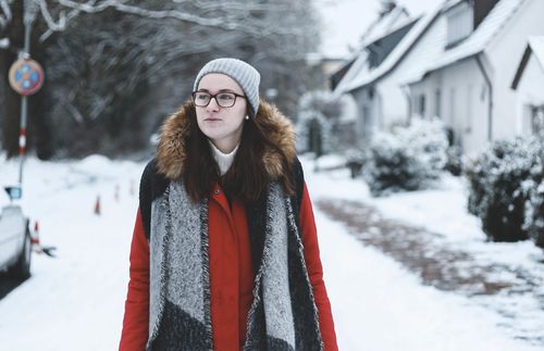 young woman walking in snow