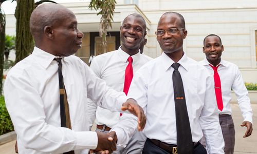 men leaving temple