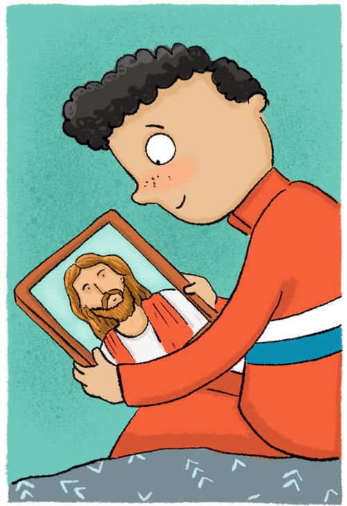 boy looking at picture of Jesus