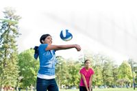 youth playing volleyball