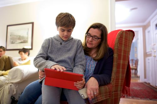 mother and son looking at tablet