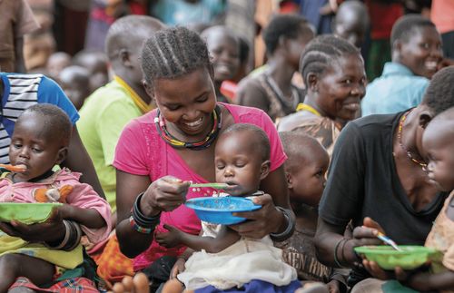 Mother feeding her child.