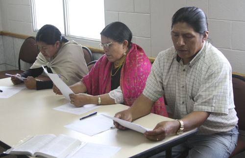 three people reading