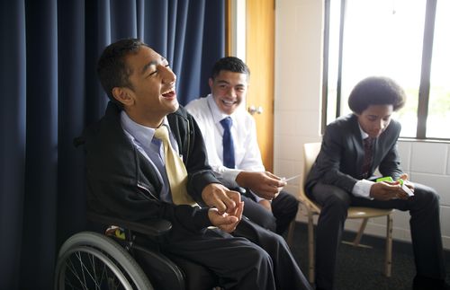 young man in wheelchair laughing