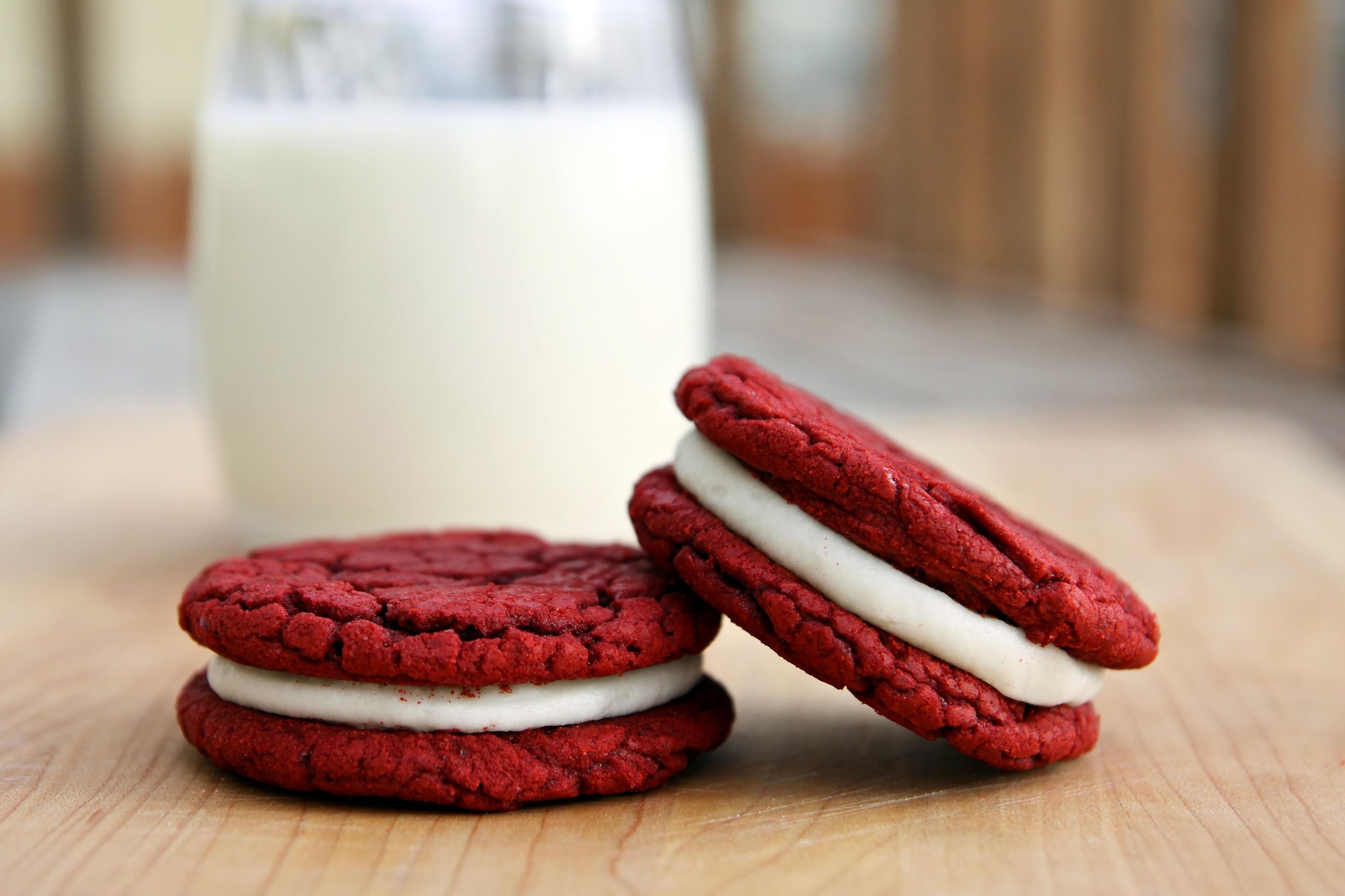 Red velvet cookies with cream and milk.