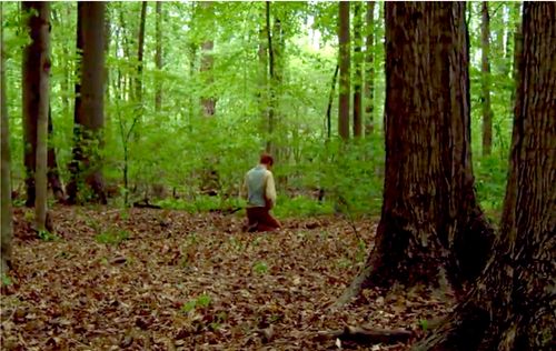 Joseph Smith kneeling in Sacred Grove