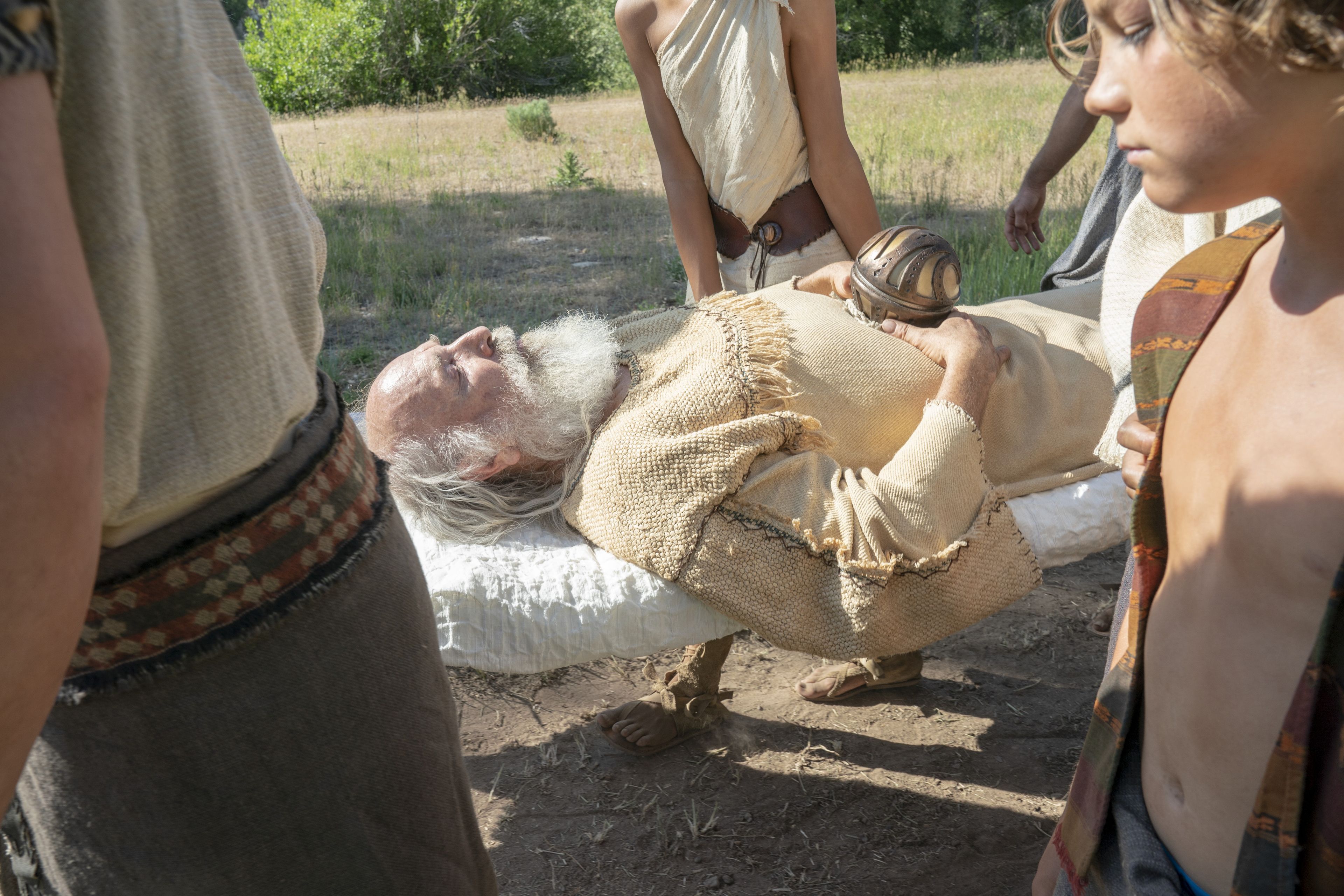 Lehi's family carries his body at his funeral.