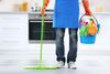 Woman with cleaning supplies