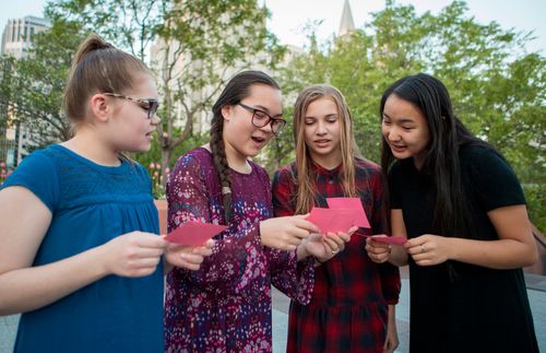 young women with temple ordinance cards