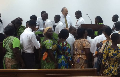 Elder Rasband with members in Ghana