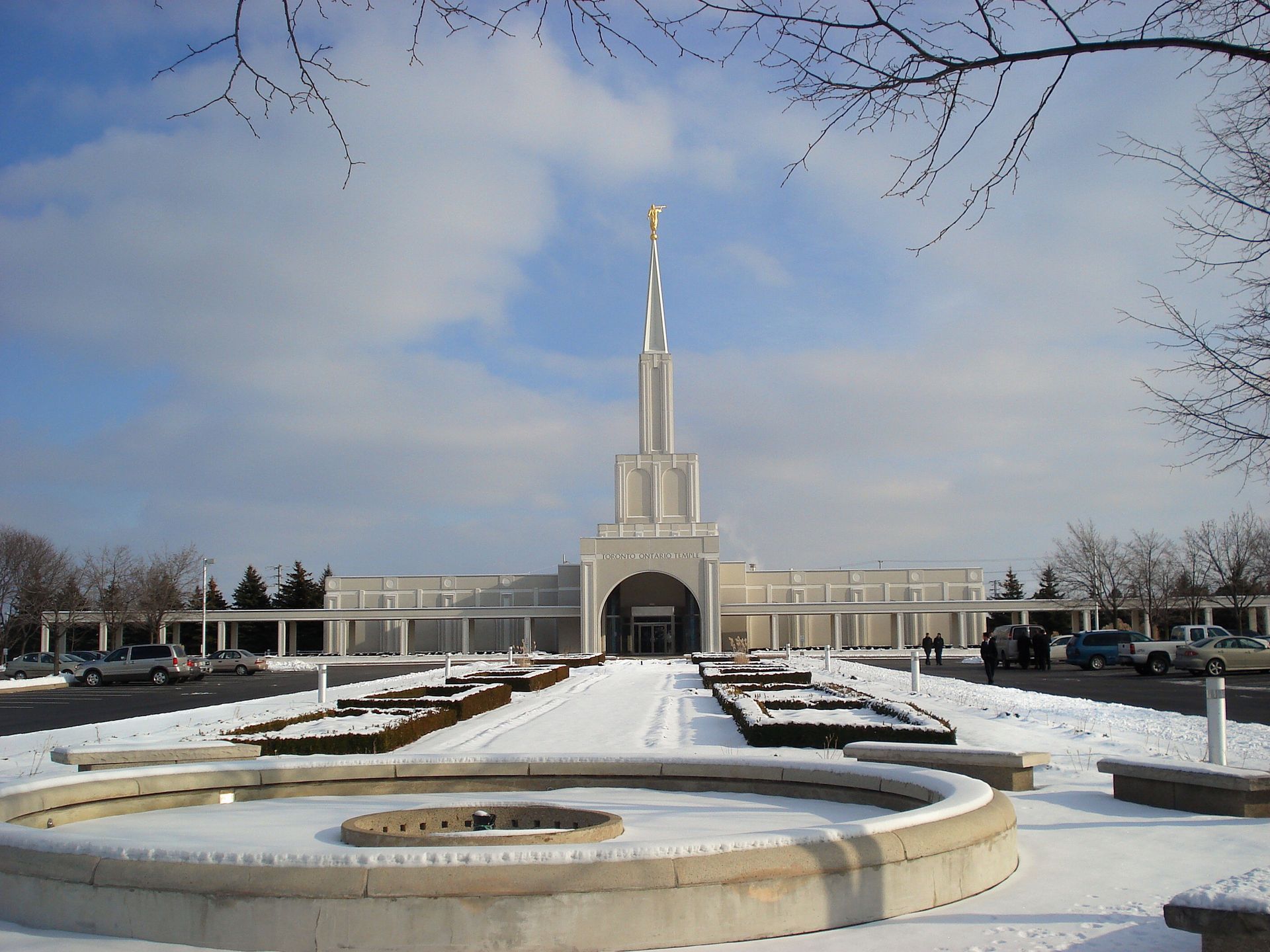 The Toronto Ontario Temple in the winter, including the fountain, entrance, and scenery.