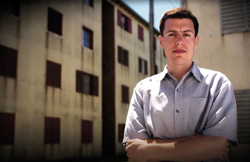 young man with arms folded