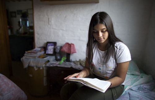 young woman studying the scriptures