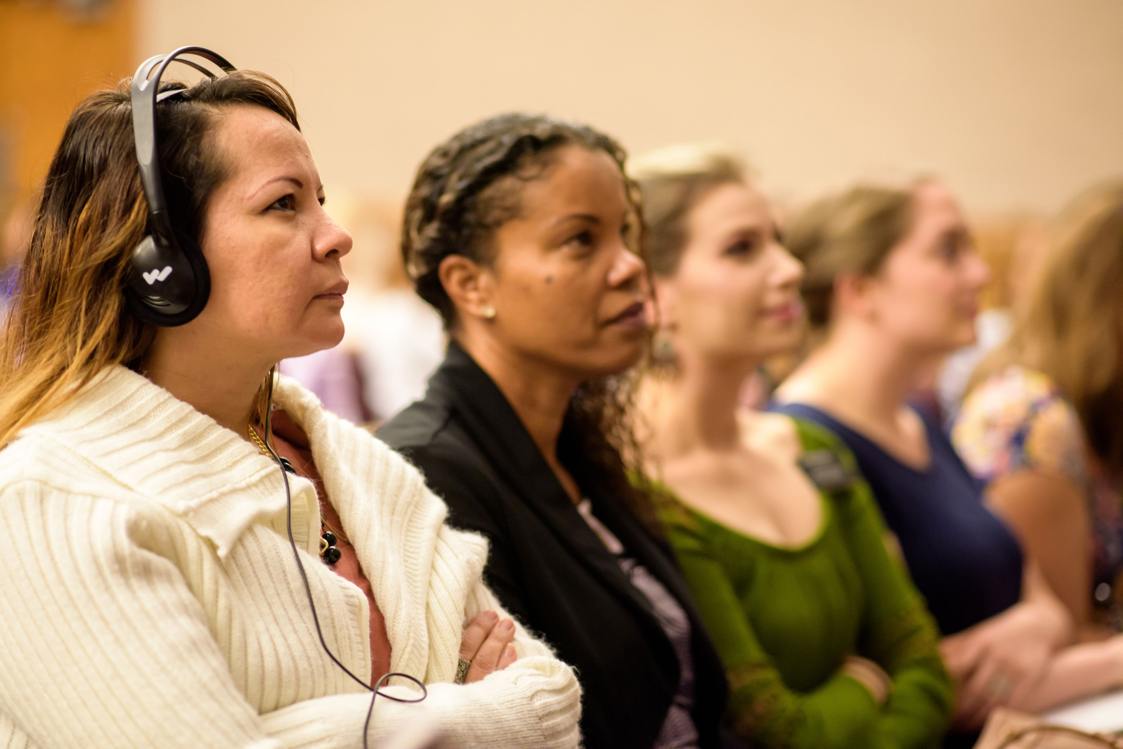 Women from a Portuguese-speaking branch watch the general women’s session of general conference in the Roswell Georgia Stake center.