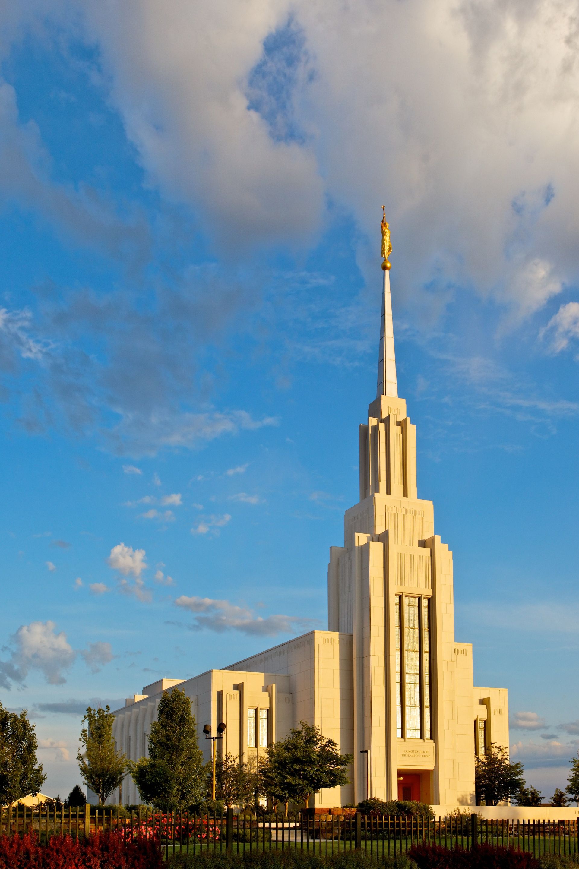 The Twin Falls Idaho Temple during daylight, including the entrance and scenery.