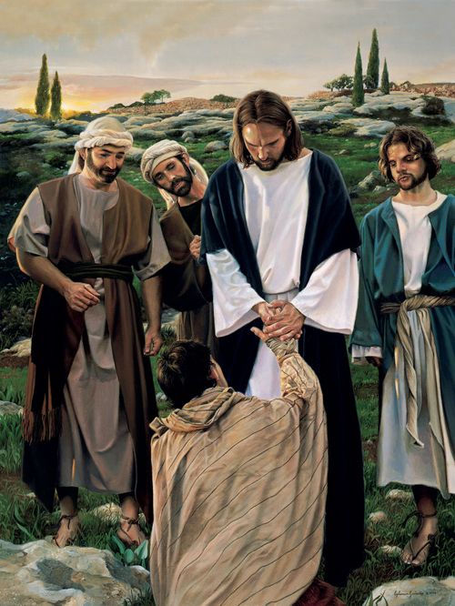 man kneeling in thanks before Jesus