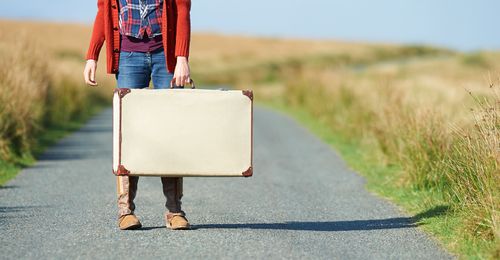 young woman with suitcase