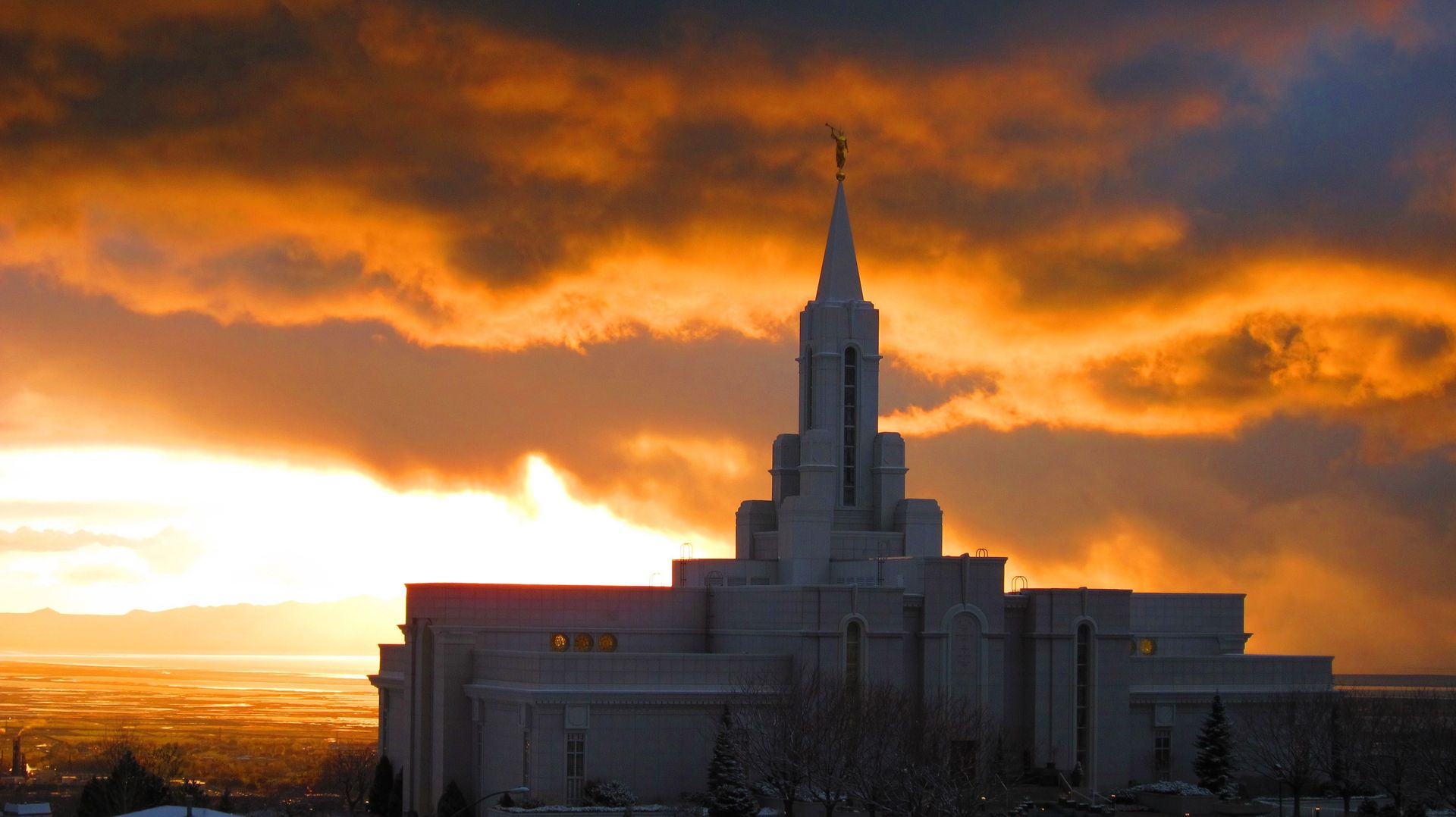 An exterior view of the back of the Bountiful Utah Temple at sunset.