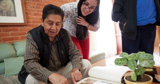 a young adult discusses family history with her grandfather