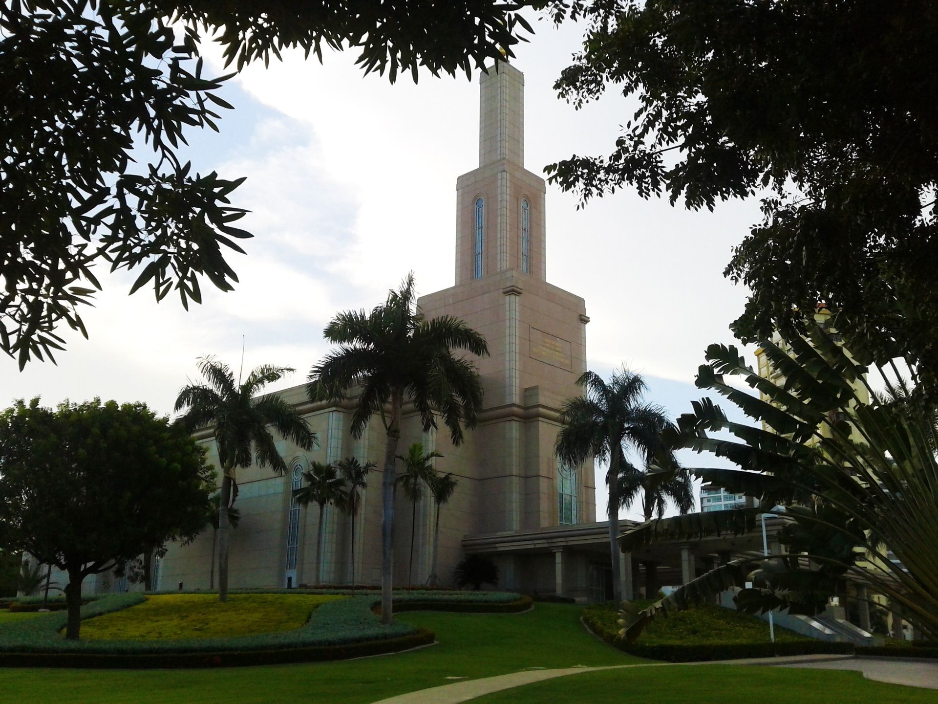 The Santo Domingo Dominican Republic Temple side view, including the scenery and entrance.