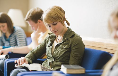 young woman reading scriptures