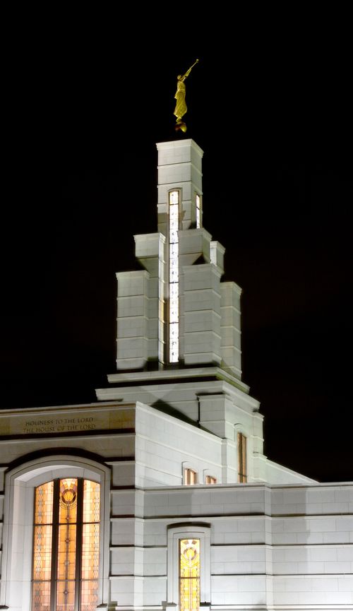 The lights on the Accra Ghana Temple’s spire at night.