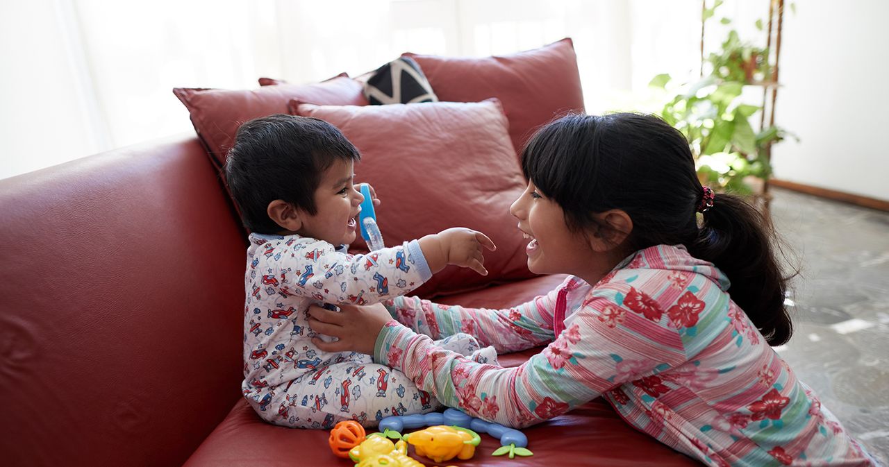 Mendoza, Argentina. A family spends the afternoon together in their home in this series of images. Images show the father and mother interacting with their children. Siblings interacting with each other. Sharing a meal together. The oldest is shown playing a keyboard with other family members sitting/standing around him.The family consists of parents, sons, daughters, and a newborn baby.