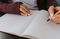 Woman writing on piece of paper