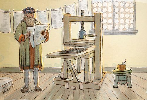 Man looking at papers next to a printing press.