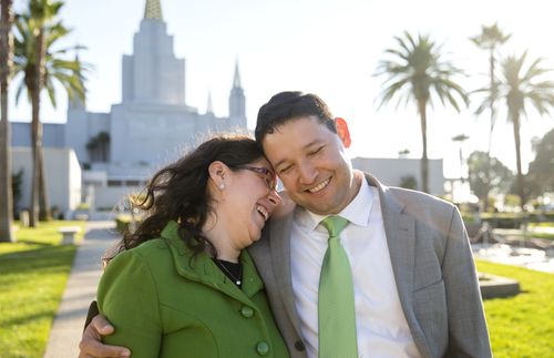 couple standing outside the Oakland California Temple