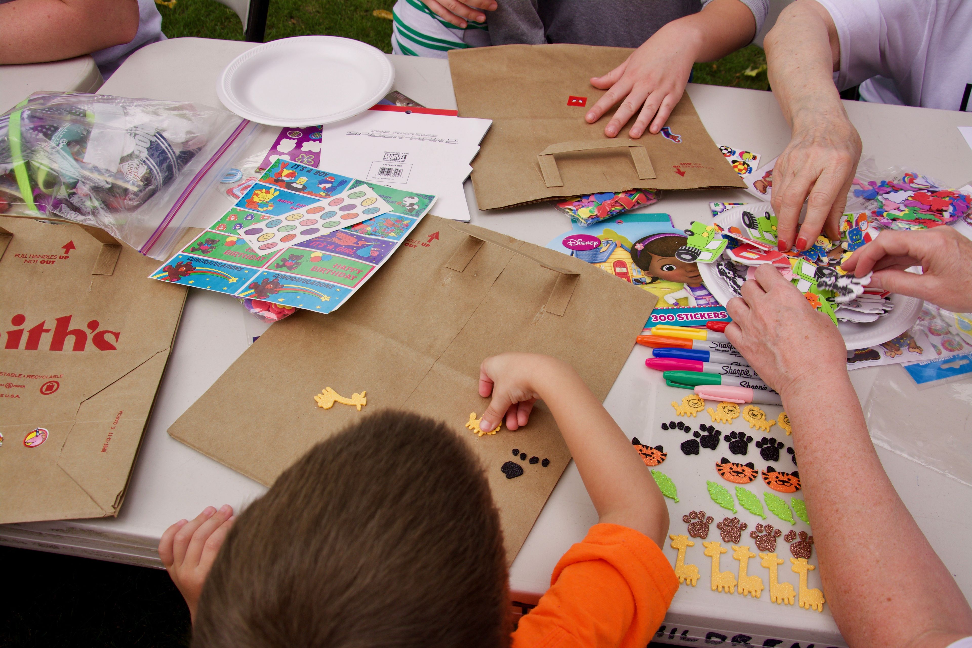 Children doing an art activity at a party.