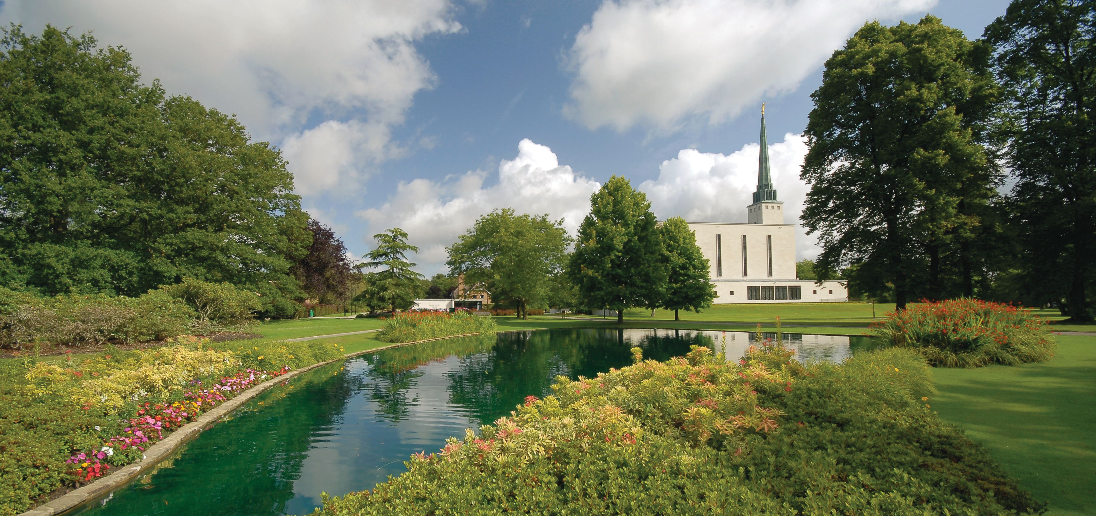 The London England Temple pond, including scenery and the exterior of the temple.