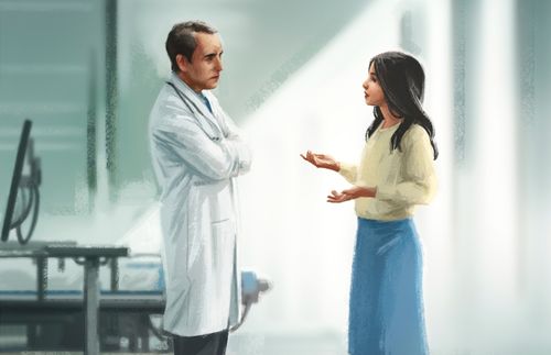 a woman talking to a surgeon