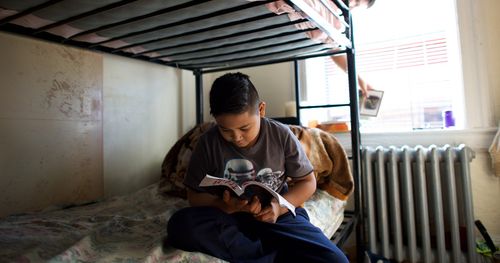 young man studying scriptures