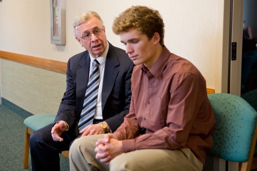 priesthood leader talking to a young man