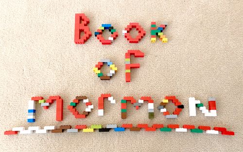 block art that says “Book of Mormon”