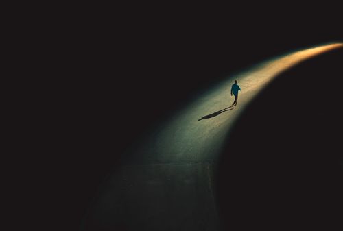 man walking in light